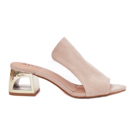 Women's flip flops on the golden pillar light beige