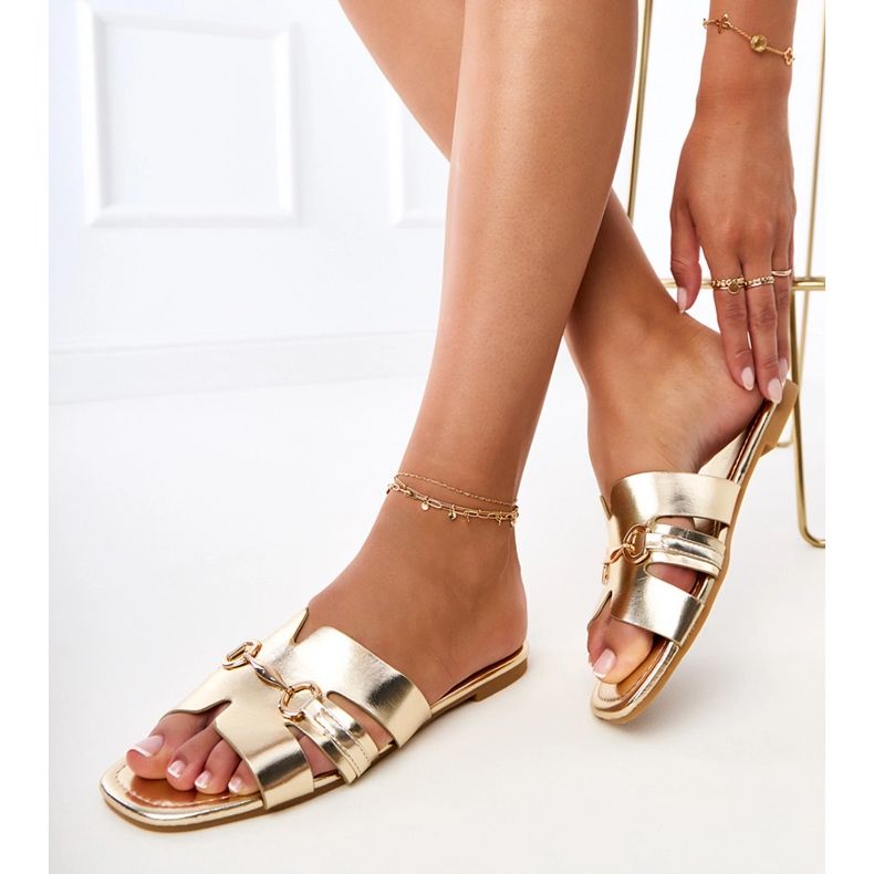 Golden flip -flops with a golden decoration Golden flip -flops with a golden decoration