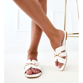 White flip flops with a golden decoration