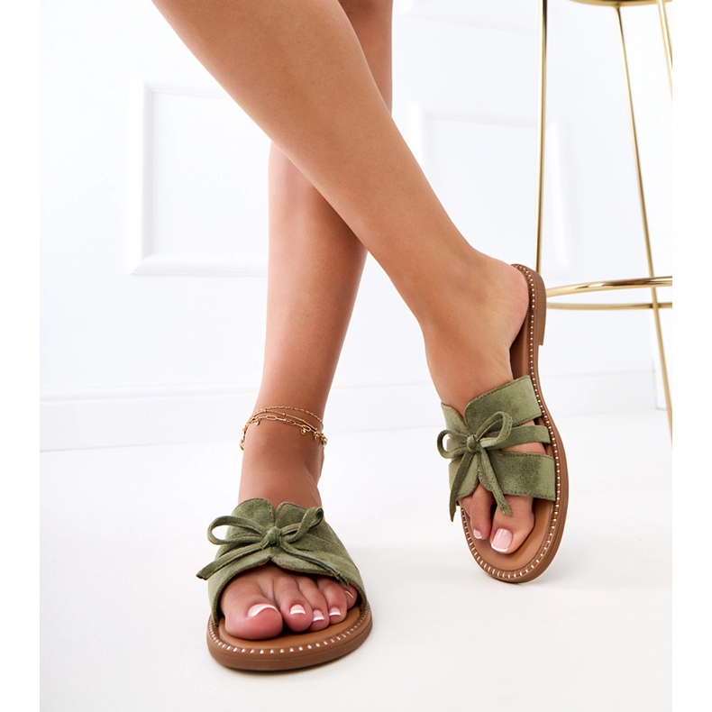 Green flip flops with a bow and decoration at the edges