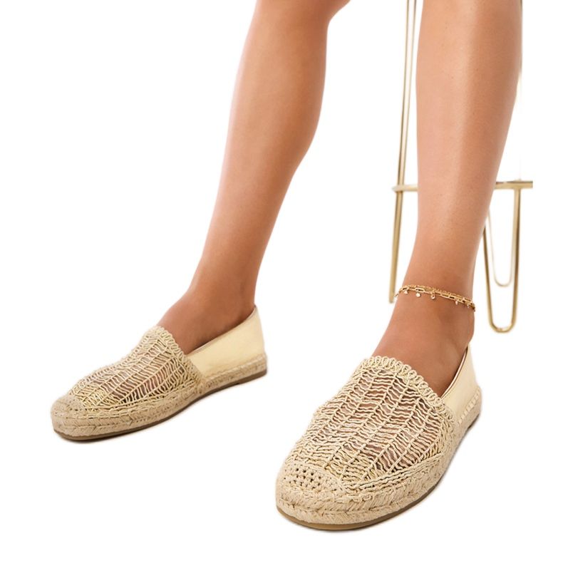 Openwork espadrilles on the platform golden