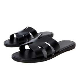 Black flip -flops decorated with cutouts