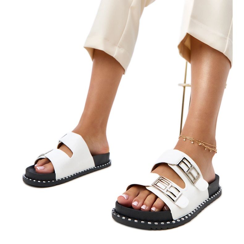 White flip flops on the Blau platform