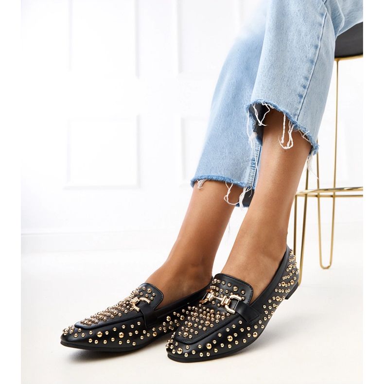 Black loafers decorated with lea studs Black loafers decorated with lea studs