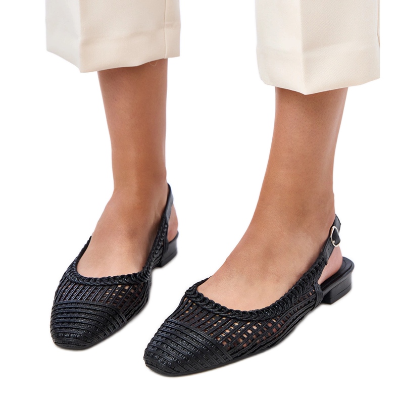 Black openwork ballerinas with an exposed Eve heel