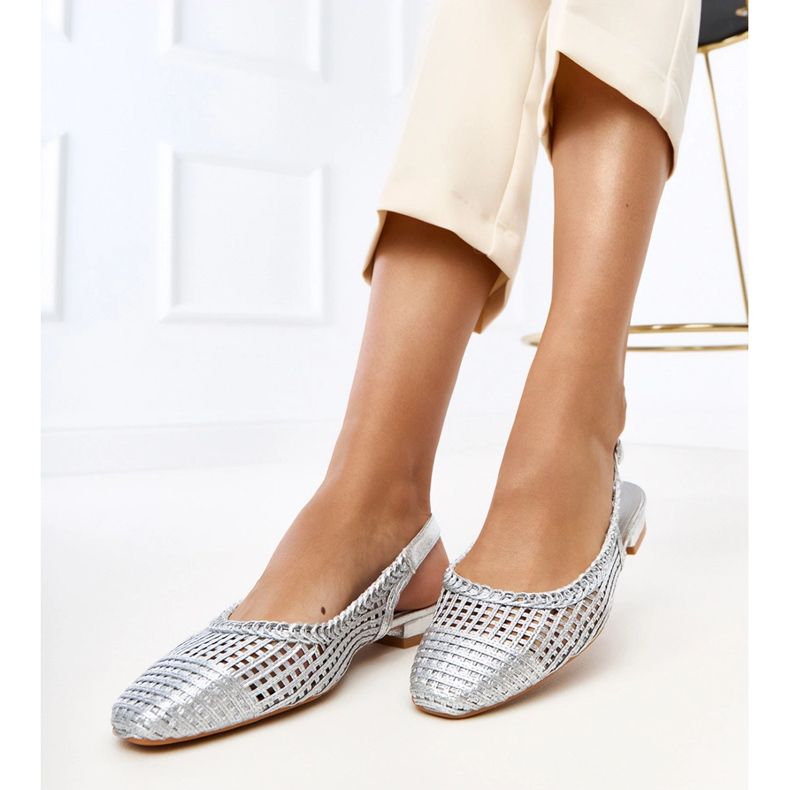 Silver openwork ballerinas with an exposed Eve heel