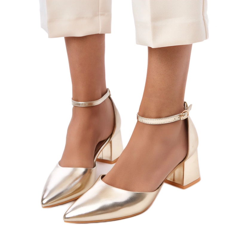 Golden pumps on the post fastened on Keris cubes Golden pumps on the post fastened on Keris cubes