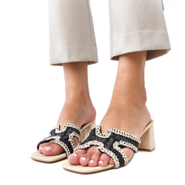 Black crochet flip flops on the Samita post