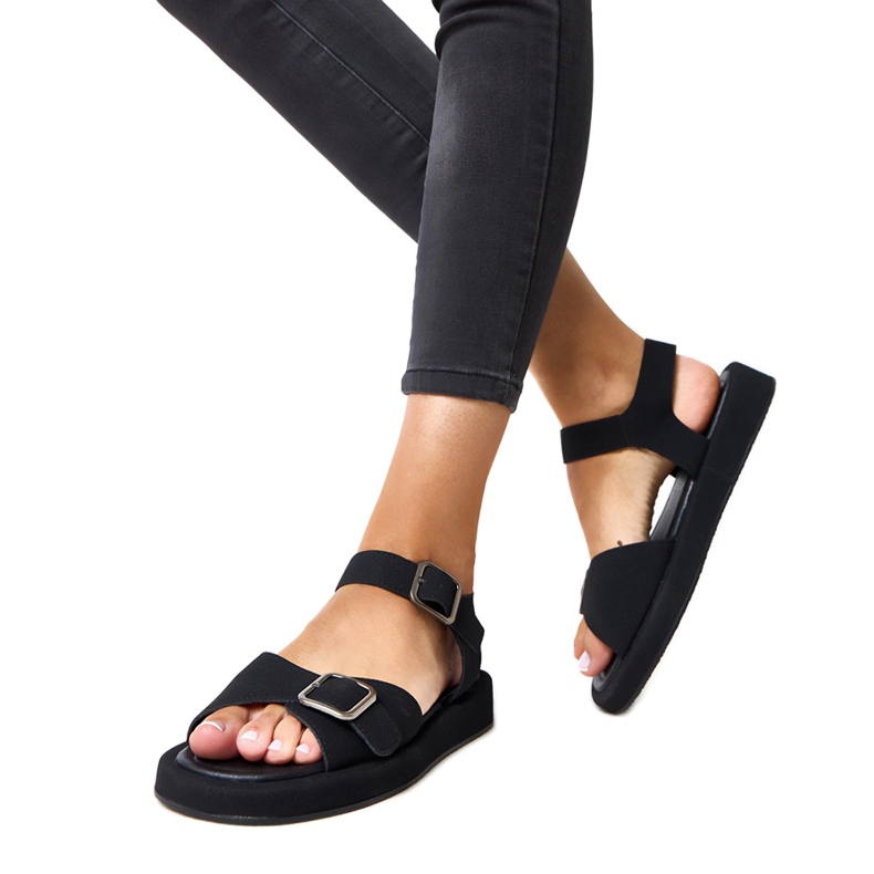 Black sandals with a buckle on the Mirkas belt