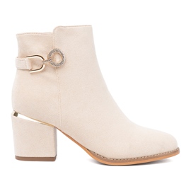 Shelvt Light beige boots on the post with a decorative clamp