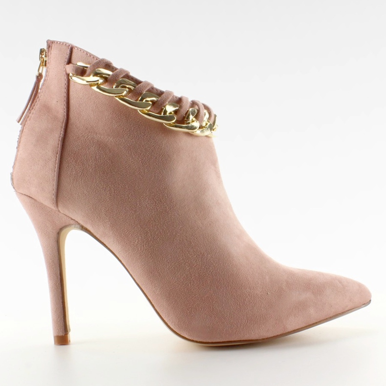 Boots on a pin with a pink suede chain