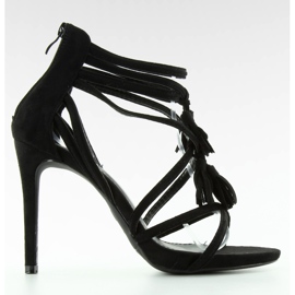 Sandals on a pin with black tassels Sandals on a pin with black tassels