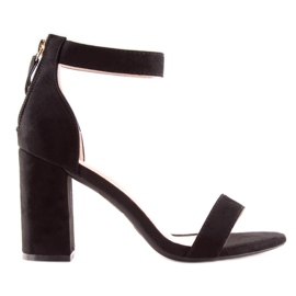 Black sandals over a wide heel black