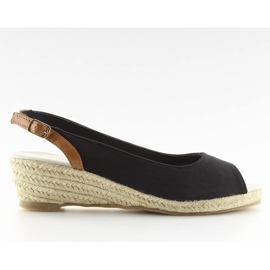 Black espadrilles on a low wedge heel