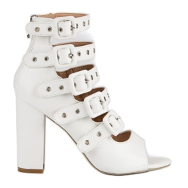 Rock sandals on the vices post white