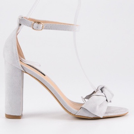 Suede sandals on a post grey