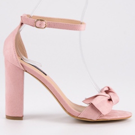 Suede sandals on a post pink
