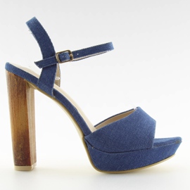 Denim sandals on a blue post 9833