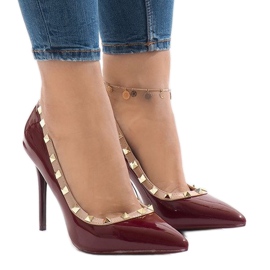 Red lacquered heels with X-68 studs Red lacquered heels with X-68 studs