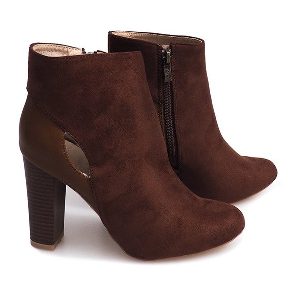 Brown Suede Boots On A Pillar With A Zipper