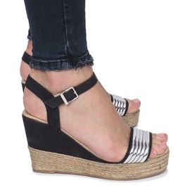 Black sandals on a delicate Glam Shine wedge heel