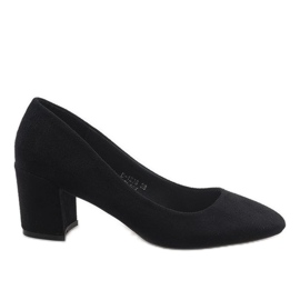 Black suede pumps on the D-1228 pillar