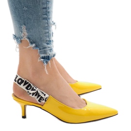 Yellow pumps on a HD-28 heel