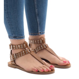 Brown flat sandals with a B12-4 buckle