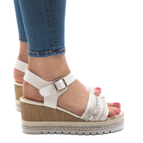White decorated sandals on the wedge YRT-72-1