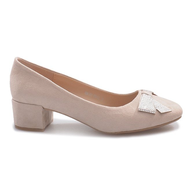 Beige pumps on a Faux pillar