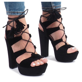 Black sandals on a One Love velor post