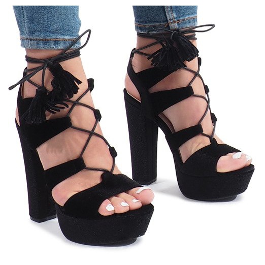 Black sandals on a One Love velor post