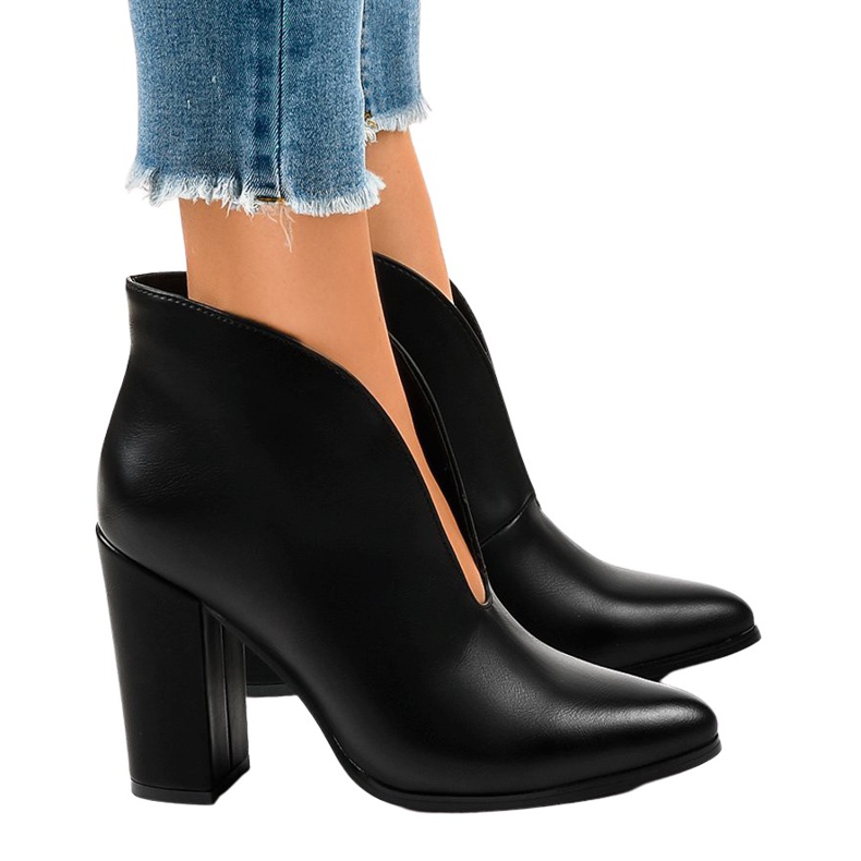 Black slip-on boots with cutouts on the RB38P post
