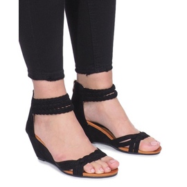 Black sandals on a delicate Desun wedge heel