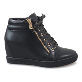 Black sneakers with a gold TL-22 zipper