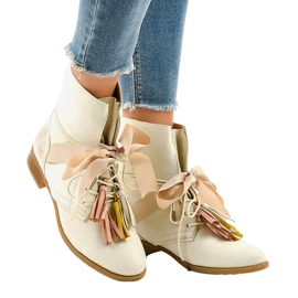Beige flat boots tied with fringes A-226