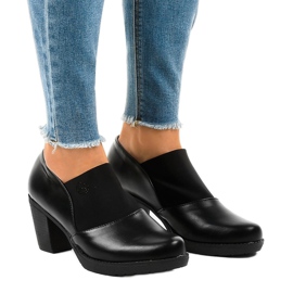 Black slip-on ankle boots on the TH-F198 post