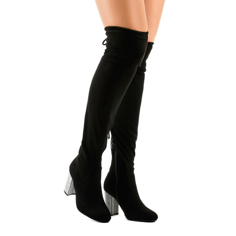 Black suede boots on a decorated post BM150