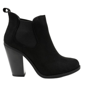 Black suede ankle boots on the H305 post