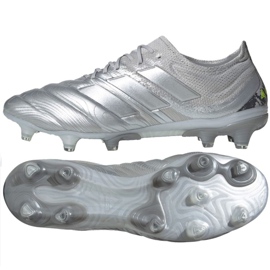 silver and red football boots