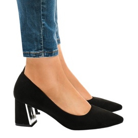 Black suede pumps on the L439 pillar