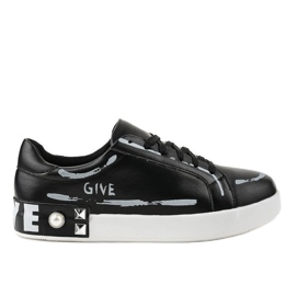 Black sneakers decorated with G272 studs