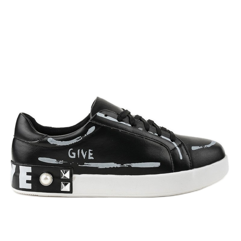 Black sneakers decorated with G272 studs