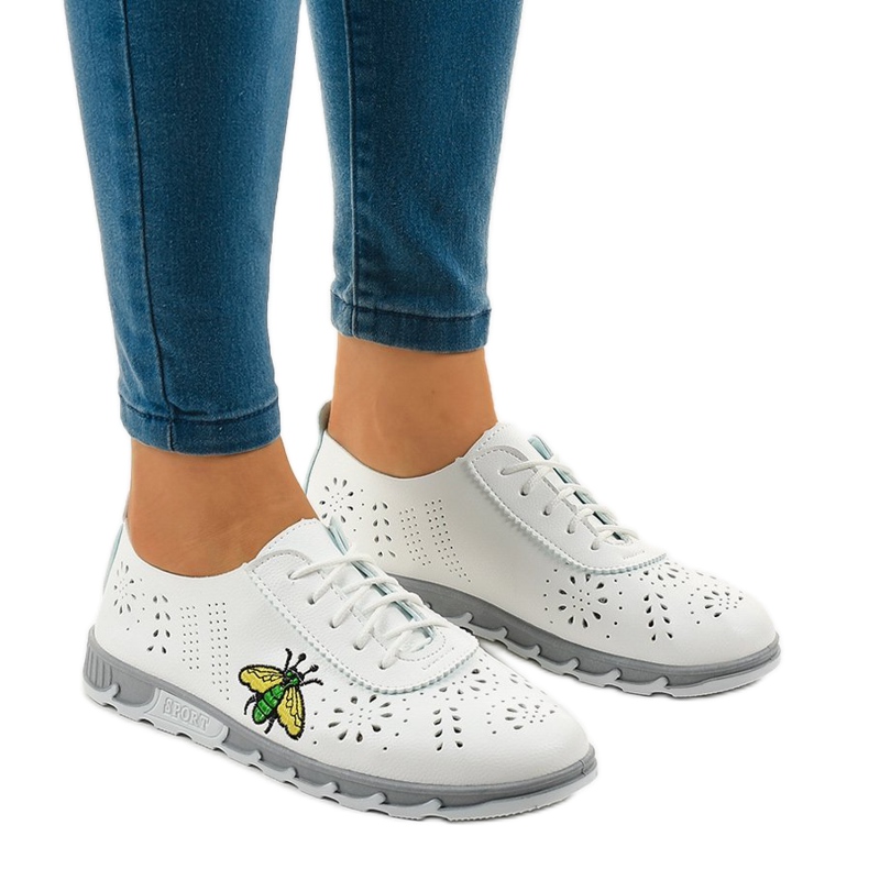 White openwork sneakers with the imprint JH81171-1