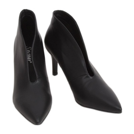 Black shoes on a black NS126P Black pin