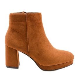 Brown suede ankle boots on the Mahoganis post yellow