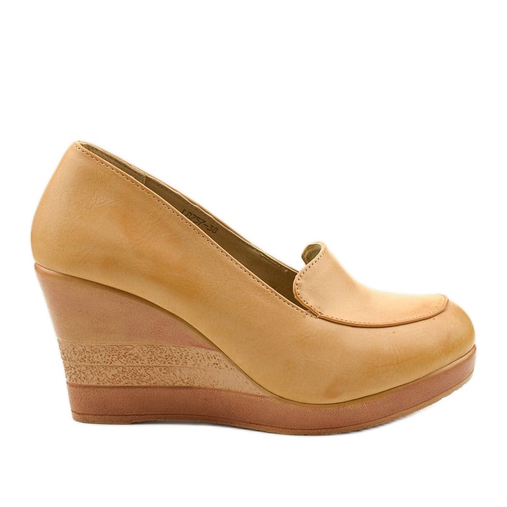 Beige pumps on the Cofton wedge heel