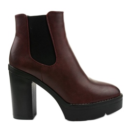 Maroon boots on the Merela post black red