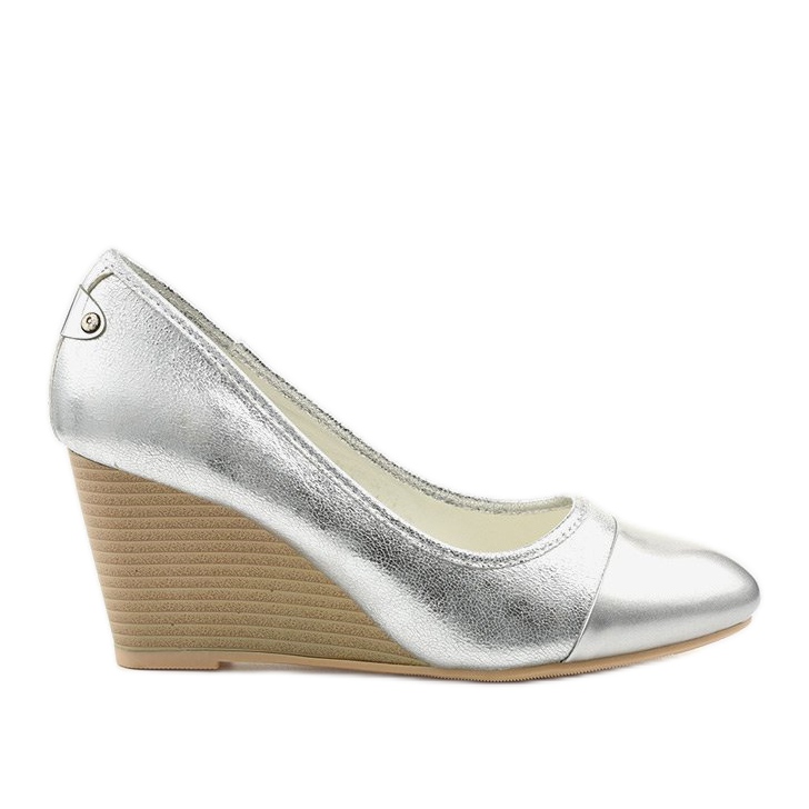 Silver pumps on the Bluehorn wedge heel