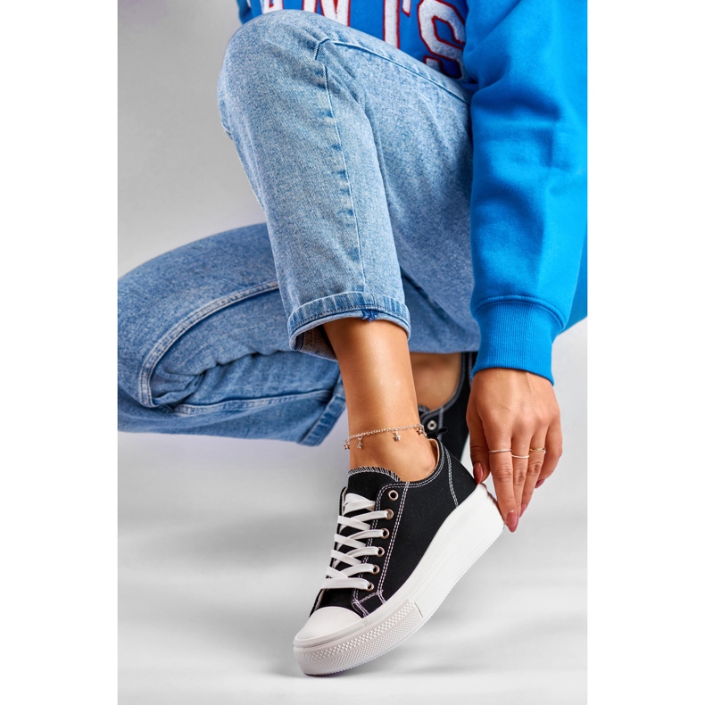 Black sneakers on a low platform 1